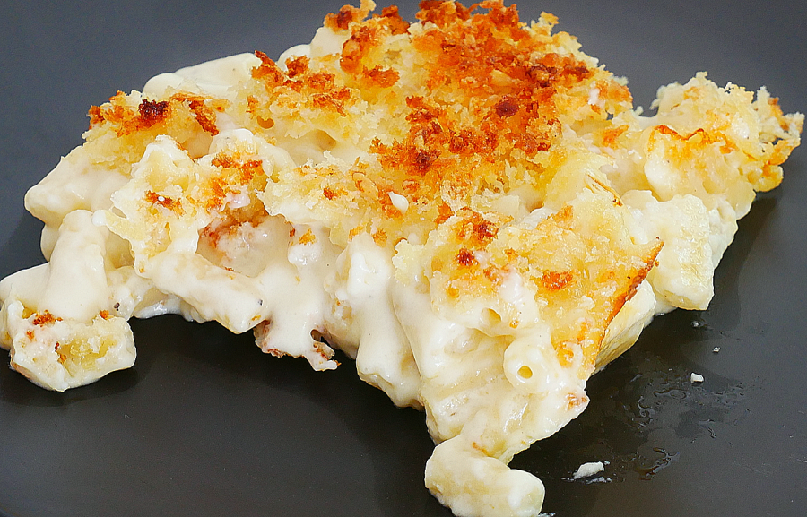 An image of a creamy baked Mac and cheese on a plate